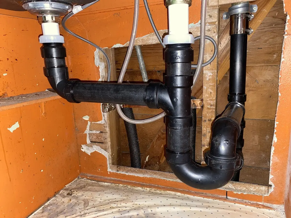 Professional Garbage Disposal Repair equipment and tools on the job in Eden